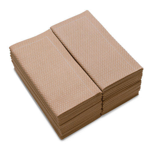 Stack of neatly folded Nude organic cotton napkins with textured finish