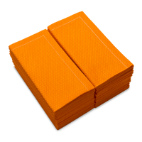 Stack of folded Persimmon organic cotton towels with textured pattern