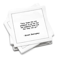 Organic cotton cocktail napkin with black dotted border printed with the quote "Only those who are prepared to go too far can possibly know how far they can go," from Five Star Napkins' Hemingway quote collection