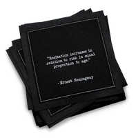Organic cotton cocktail napkin, black, with white dotted border printed with the quote "Hesitation increases in relation to risk in equal proportion to age," from Five Star Napkins' Hemingway quote collection
