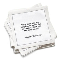 Organic cotton cocktail napkin, white, with black dotted border printed with the quote "Hesitation increases in relation to risk in equal proportion to age," from Five Star Napkins' Hemingway quote collection
