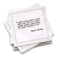 Stack of cotton cocktail napkins with a Wayne Gretzky quote on a white background
