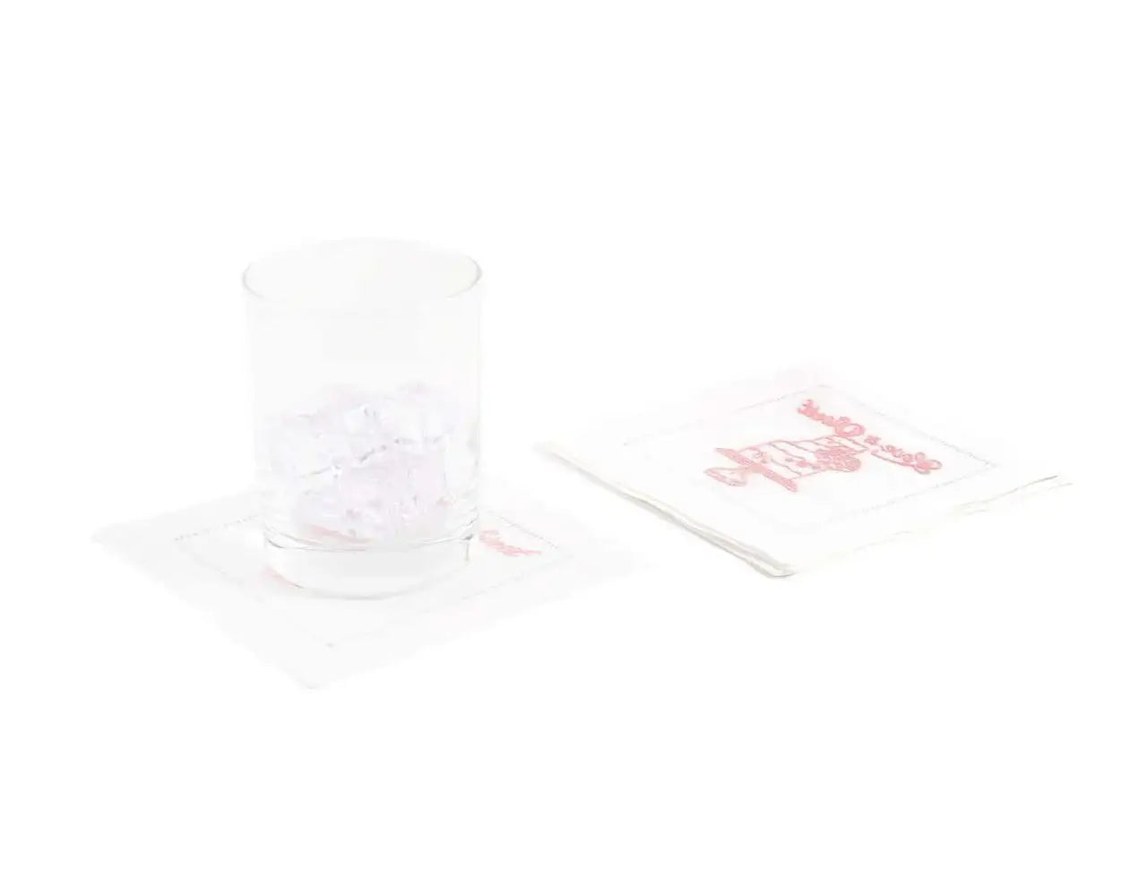 Organic cotton cocktail napkins with 'LOVE IS SWEET' quote in pink, glass with ice on top