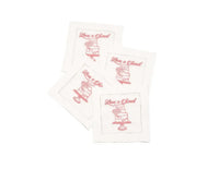 Set of four organic cotton cocktail napkins with 'Love is Sweet' printed quote and cake design.