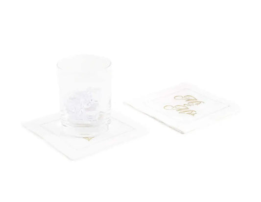 White organic cotton cocktail napkins with gold 'Mr & Mrs' script, glass on top, table setting