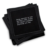 Stack of black marriage quote cocktail napkins with white typewriter-style text reading, “Being married is like having a best friend who doesn’t remember anything you say.”