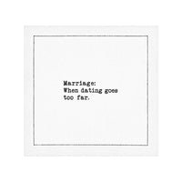 White marriage quote cocktail napkin with black typewriter-style text reading, “Marriage: When dating goes too far.”