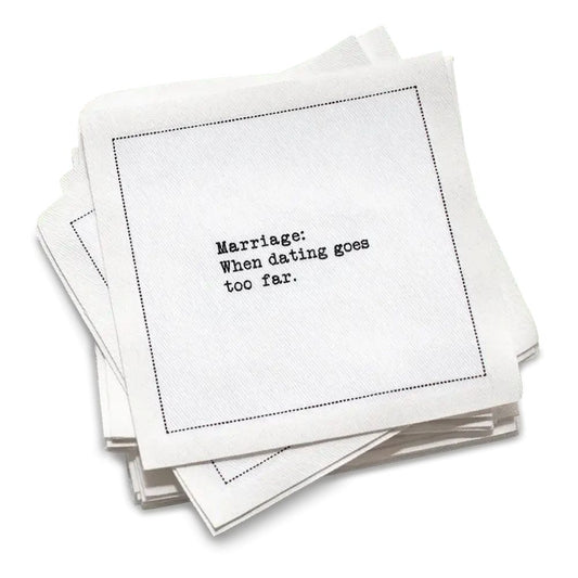 Stack of white marriage quote cocktail napkins with black typewriter-style text reading, “Being married is like having a best friend who doesn’t remember anything you say.”