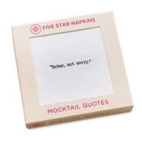 Gift box from Five Star Napkins' Mocktail quote collection, showing an organic cotton cocktail napkin printed with the quote "Sober, not sorry"