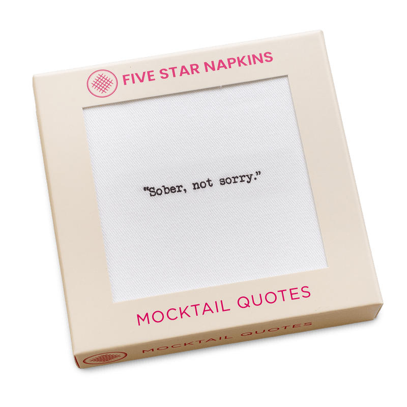 Gift box from Five Star Napkins' Mocktail quote collection, showing an organic cotton cocktail napkin printed with the quote "Sober, not sorry"