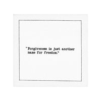 Organic cotton cocktail napkin with printed quote: 'Forgiveness is just another name for freedom.'