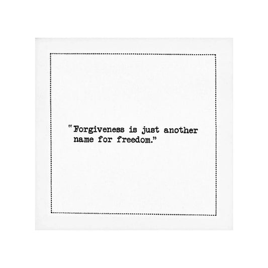 Organic cotton cocktail napkin with printed quote: 'Forgiveness is just another name for freedom.'