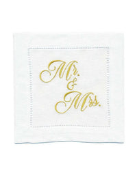 Organic cotton cocktail napkin with hemstitched border, embroidered with “Mr. & Mrs.” in gold script, by Five Star Napkins.