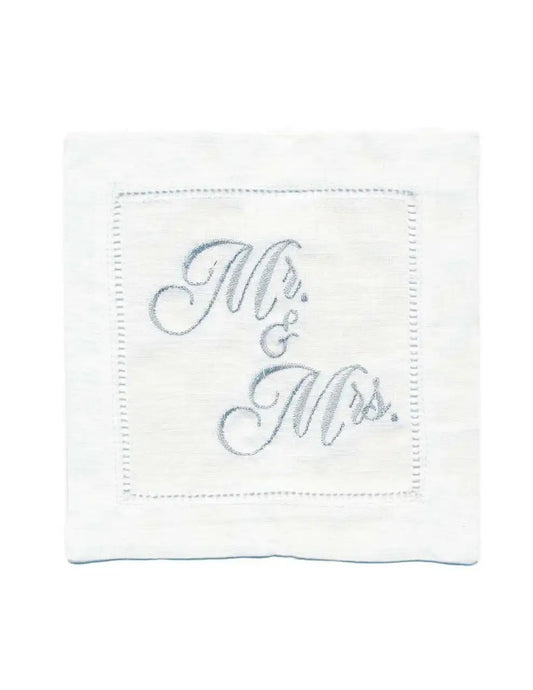 Organic cotton cocktail napkin with hemstitched border, embroidered with “Mr. & Mrs.” in silver script, by Five Star Napkins.