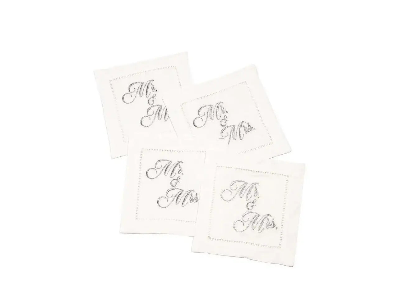 Set of four organic cotton cocktail napkins embroidered with “Mr. & Mrs.” in silver script, by Five Star Napkins.