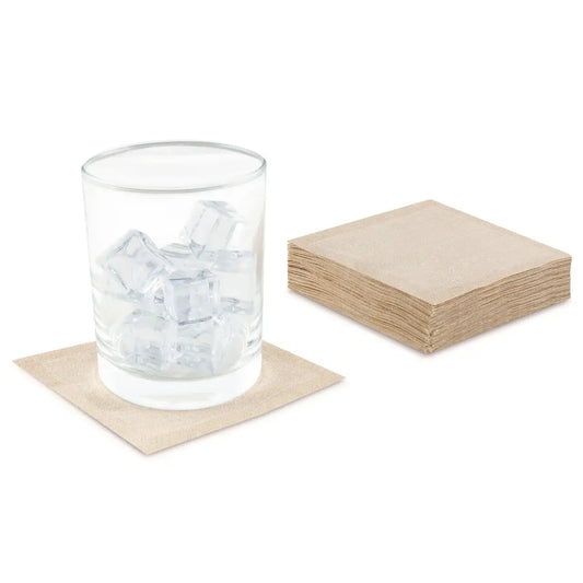 Stack of Signature Napkin Linen Cocktail organic cotton napkins in Natural color, glass with ice