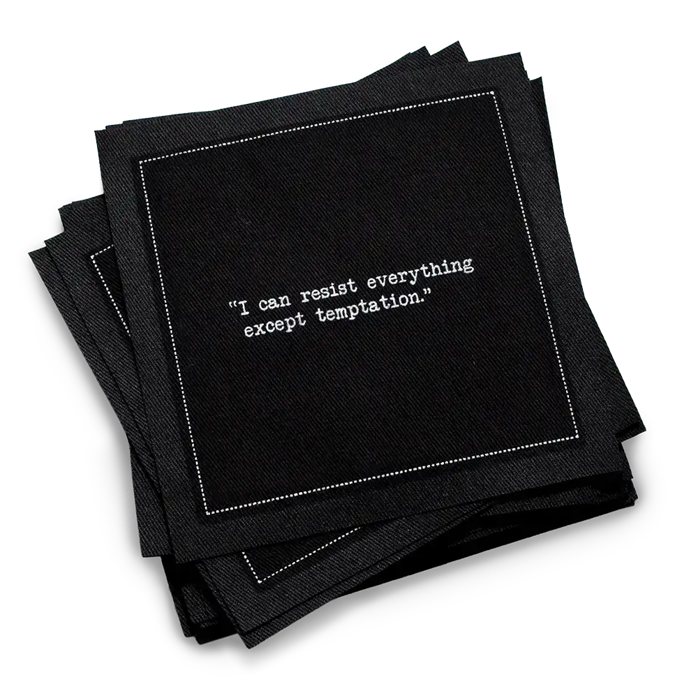 Organic cotton cocktail napkin, black, with white dotted border printed with the quote "I can resist everything except temptation," from Five Star Napkins' Oscar Wilde quote collection