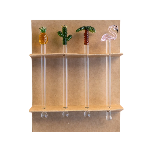 Four glass swizzle sticks — pineapple, cactus, palm tree, and flamingo — displayed in their kraft gift box, by Five Star Napkins.
