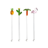 Four glass swizzle sticks topped with pineapple, cactus, palm tree, and flamingo designs, by Five Star Napkins.