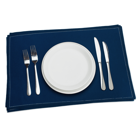 Luxury navy blue organic cotton placemat with white plate and silver cutlery set