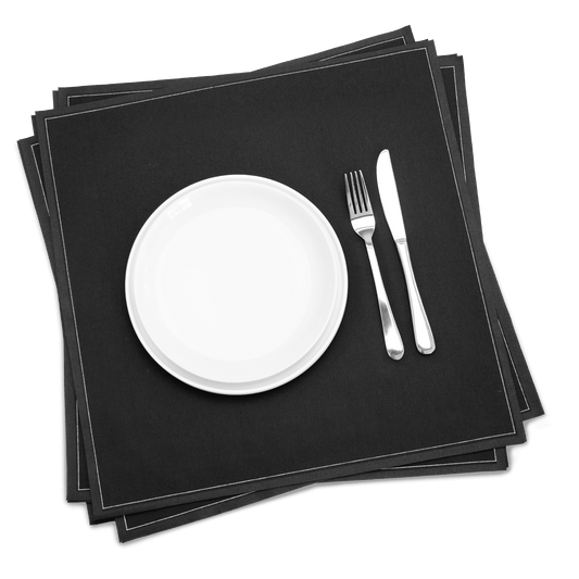 Black luxury cotton dinner napkins with white plate, fork, and knife, elegant table setting.