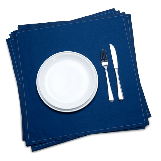 Midnight blue organic cotton dinner napkins with white plate and silverware, luxury table setting