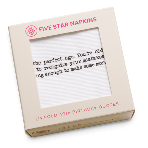 Kraft gift box from Five Star Napkins' 1/4 Fold 40th Birthday Quotes collection, showing an organic cotton quarter-fold napkin printed with the quote "40 is the perfect age. You're old enough to recognize your mistakes but young enough to make some more"