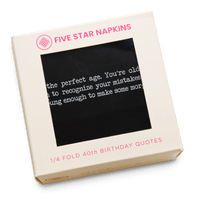 Kraft gift box from Five Star Napkins' 1/4 Fold 40th Birthday Quotes collection, showing an organic cotton quarter-fold napkin, black, printed with the quote "40 is the perfect age. You're old enough to recognize your mistakes but young enough to make some more"