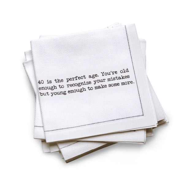 Organic cotton quarter-fold napkin, white, with black dotted border printed with the quote "40 is the perfect age. You're old enough to recognize your mistakes but young enough to make some more," from Five Star Napkins' 40th birthday quote collection