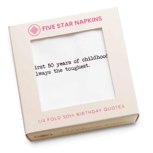 Kraft gift box from Five Star Napkins' 1/4 Fold 50th Birthday Quotes collection, showing an organic cotton quarter-fold napkin printed with the quote "The first 50 years of childhood are always the toughest"