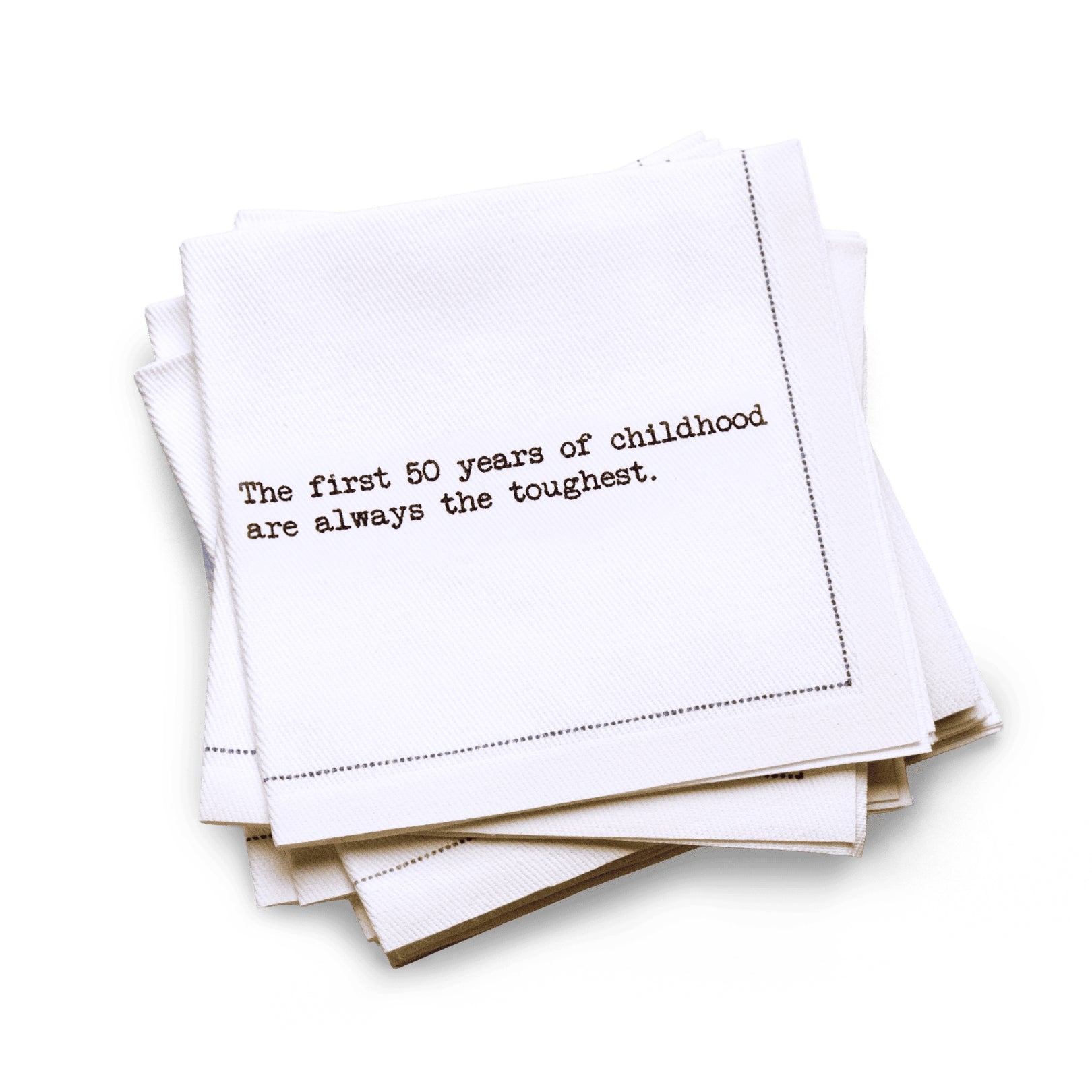 Organic cotton quarter-fold napkin with black dotted border printed with the quote "The first 50 years of childhood are always the toughest," from Five Star Napkins' 50th birthday quote collection