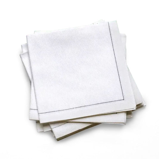 Stack of white organic cotton cocktail napkins in a quarter fold with a stitched border, by Five Star Napkins.