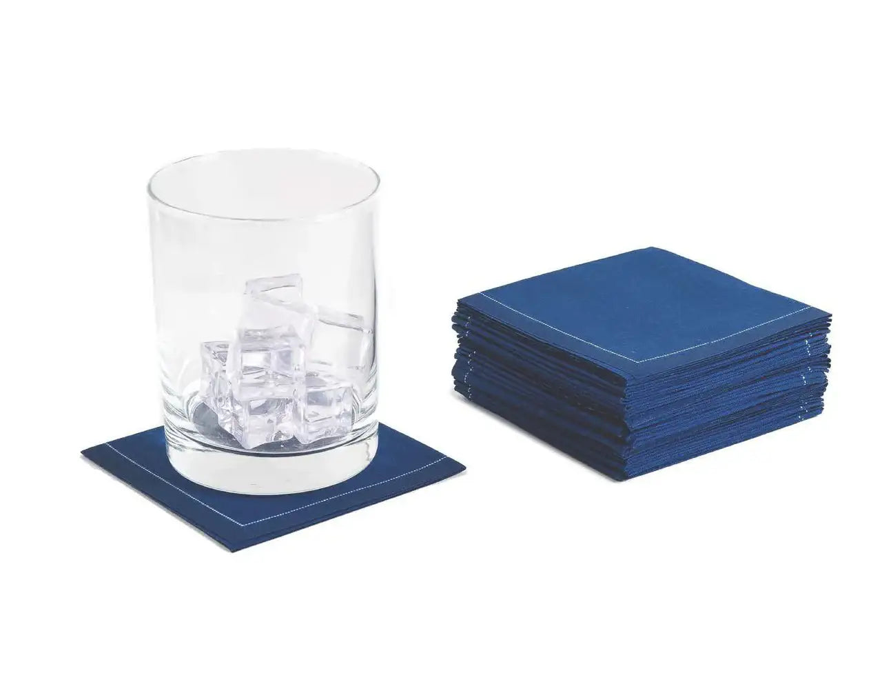 Stack of Midnight Blue organic cotton cocktail napkins with glass on one napkin