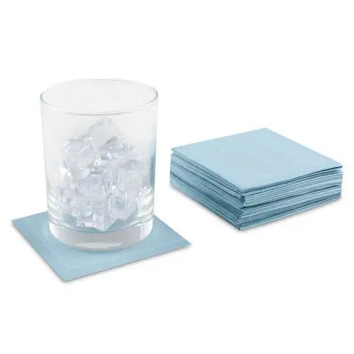 Sky Blue organic cotton cocktail napkins in a stack with a glass of ice on one napkin