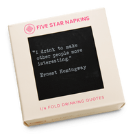 Kraft gift box from Five Star Napkins' Drinking Quotes First Edition collection, showing a quarter-fold organic cotton cocktail napkin, black, printed with the quote "I drink to make other people more interesting"