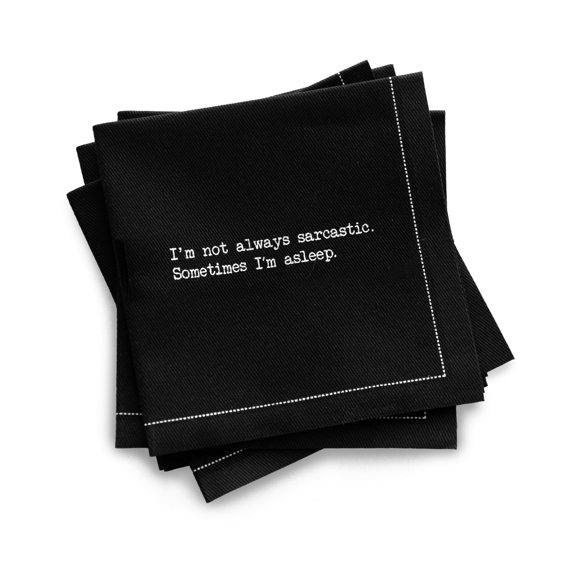 Quarter-fold organic cotton cocktail napkin, black, with white dotted border printed with the quote "I'm not always sarcastic. Sometimes I'm asleep," from Five Star Napkins' Snarky quote collection