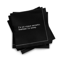 Quarter-fold organic cotton cocktail napkin, black, with white dotted border printed with the quote "I'm not always sarcastic. Sometimes I'm asleep," from Five Star Napkins' Snarky quote collection