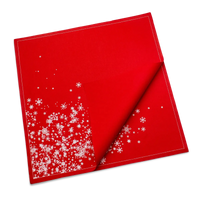 Folded red organic cotton dinner napkin with white snowflake cascade pattern, by Five Star Napkins.