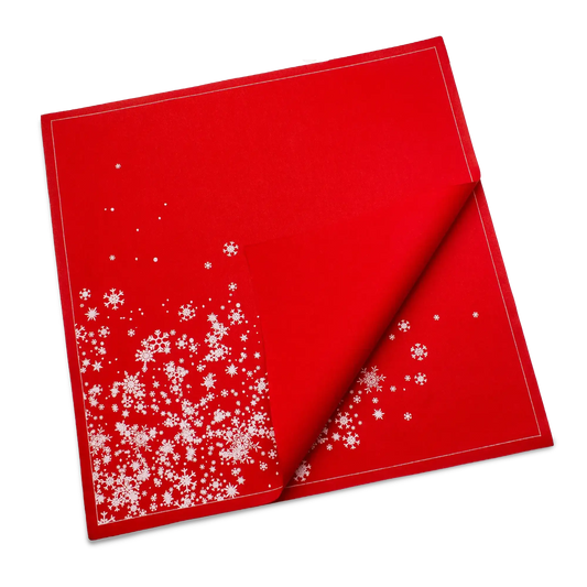 Folded red organic cotton dinner napkin with white snowflake cascade pattern, by Five Star Napkins.