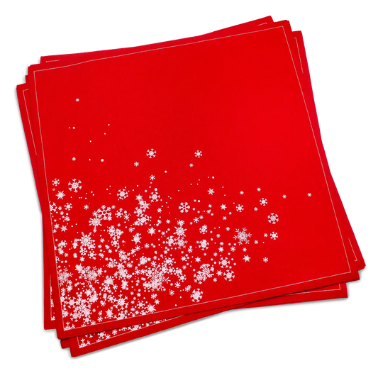 Stack of red organic cotton dinner napkins with white snowflake cascade pattern, by Five Star Napkins.