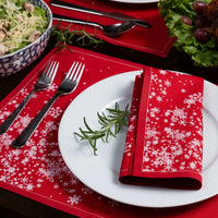 Organic cotton placemat and napkin in Toreador with white snowflake pattern on a holiday table setting
