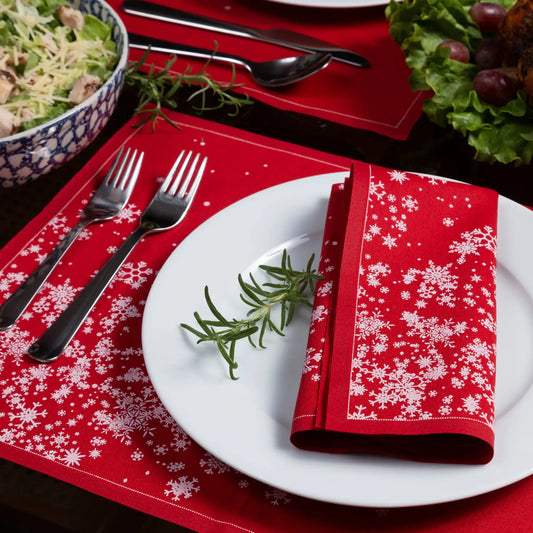 Organic cotton placemat and napkin in Toreador with white snowflake pattern on a holiday table setting