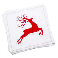 Stack of white organic cotton luncheon napkins printed with a red leaping reindeer silhouette, by Five Star Napkins.