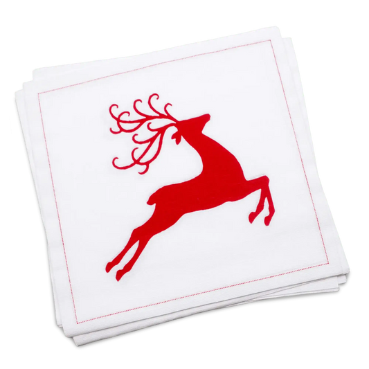 Stack of white organic cotton luncheon napkins printed with a red leaping reindeer silhouette, by Five Star Napkins.