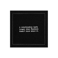 Anthracite Grey organic cotton napkin with printed quote: 'A relationship lasts longer when Facebook doesn’t know about it.'