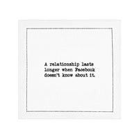 White organic cotton napkin with printed quote: 'A relationship lasts longer when Facebook doesn't know about it.'