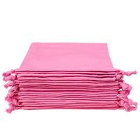 Stack of rose organic cotton pouches with knotted drawstring closure
