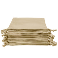 Stack of sand color organic cotton pouches with drawstrings, neatly folded