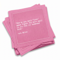 A stack of sherbet-pink Love Quotes cocktail napkins with white dotted borders. The top napkin reads, “How do you spell ‘love?’ asked Piglet. You don’t spell it, you feel it,” answered Pooh. —A. A. Milne.