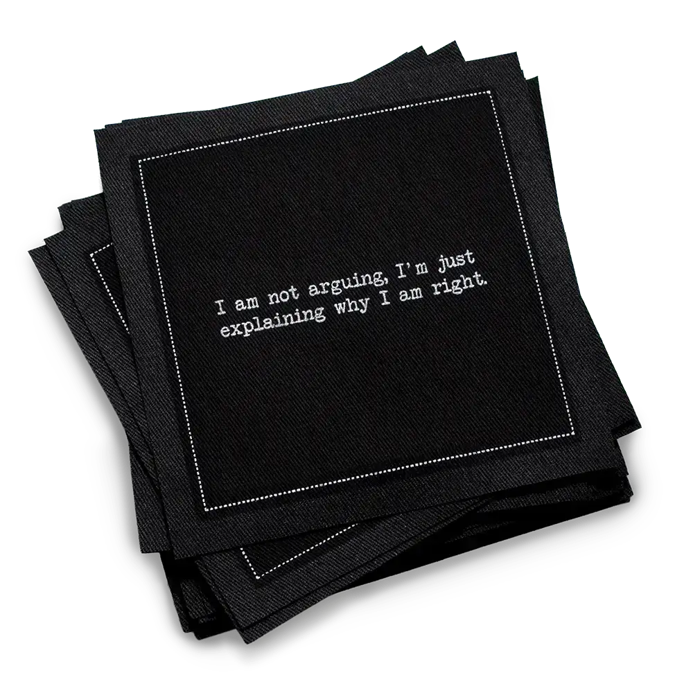 Organic cotton cocktail napkin, black, with white dotted border printed with the quote "I am not arguing, I'm just explaining why I am right," from Five Star Napkins' Snarky quote collection